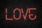 Preview: Fototapete Love Leuchtschrift auf Steinwand