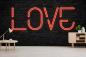 Preview: Fototapete Love Leuchtschrift auf Steinwand