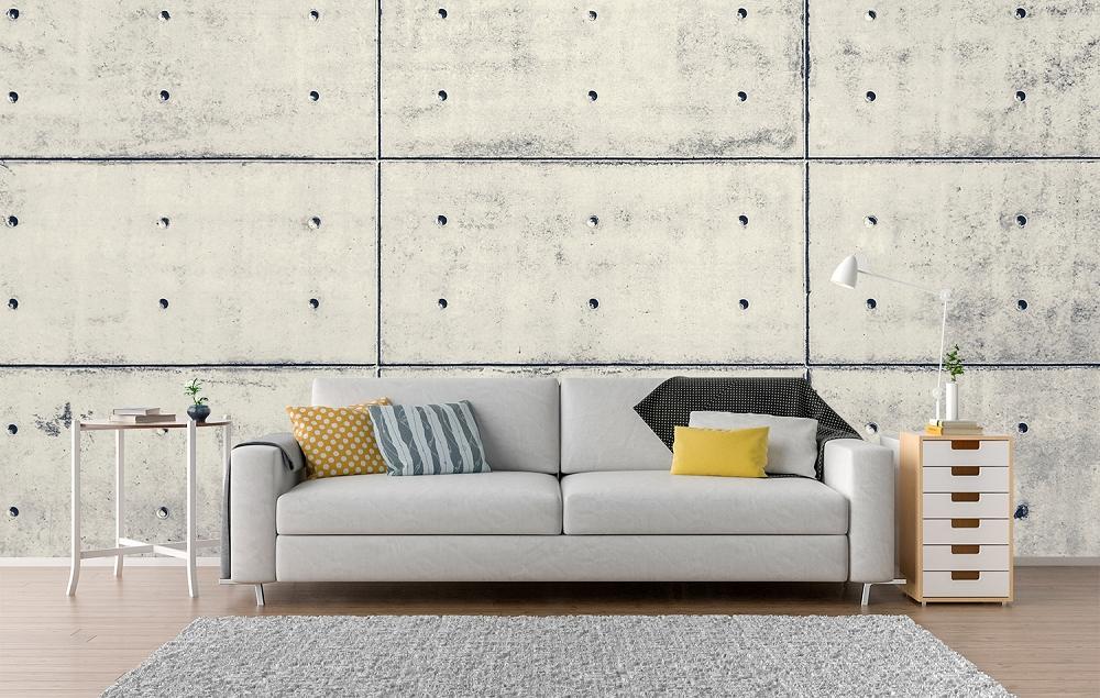 Vlies-Fototapete Betonwand mit Löchern in einem Farbton in Creme