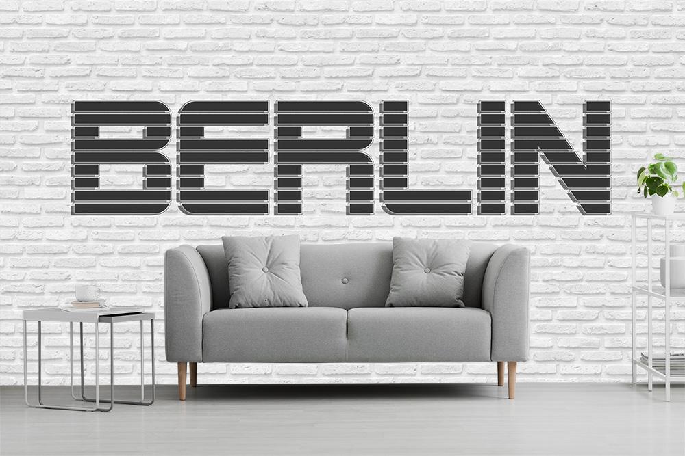 Vlies-Fototapete – Futuristischer Berlin-Schriftzug auf weißer Steinwand