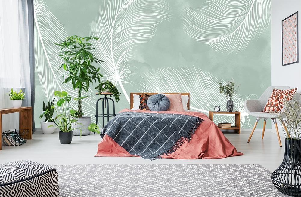 Fototapete mit fliegenden Federn auf einem Aquarell-Hintergrund in Grün